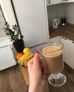 Photo that the WhatsApp scammer used, showing a woman's hand holding a flat white coffee cup.