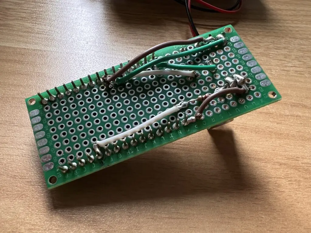 Backside photo of a soldered and tidier pcb