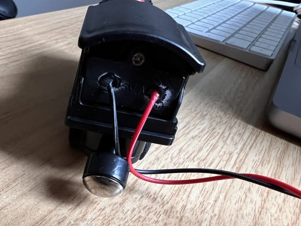 photo of a toy railwaycart with two wires sticking out