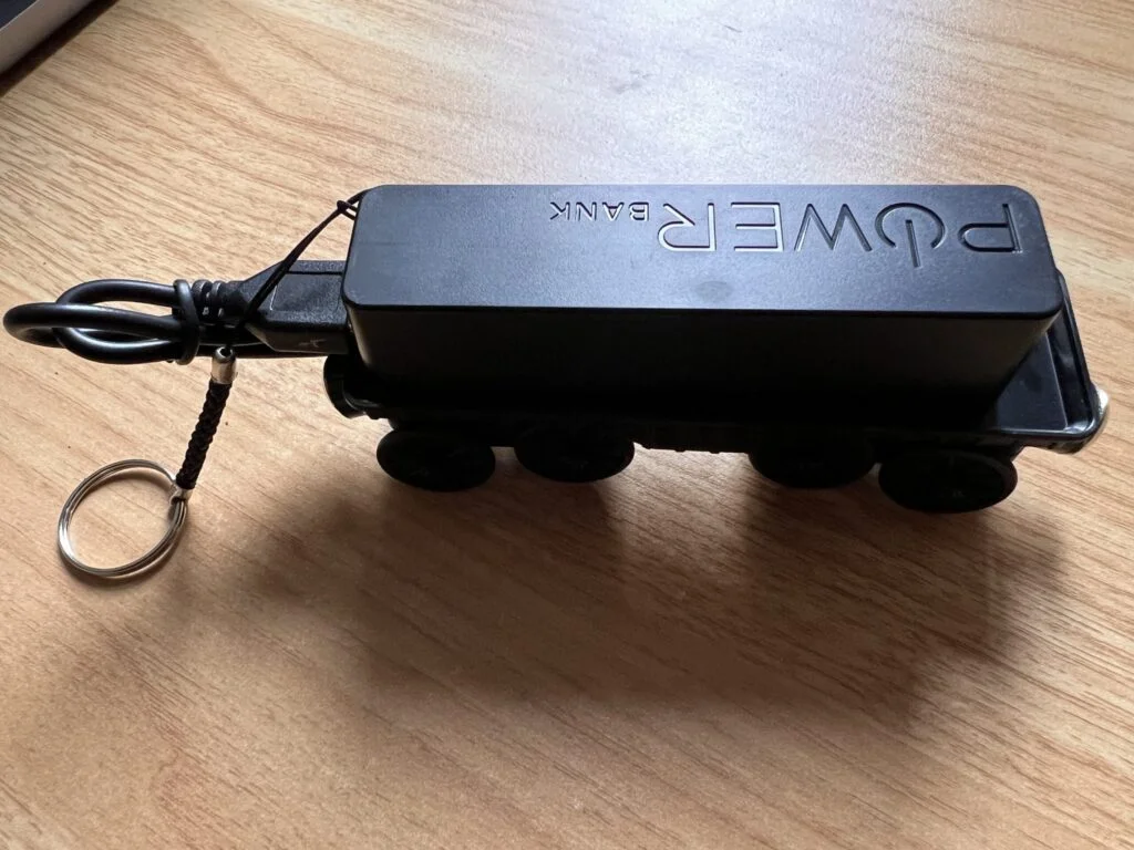 Photo of a powerbank on top of a toy railcart